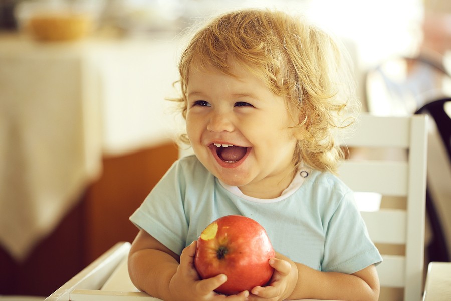 Laughing Baby Boy With Apple